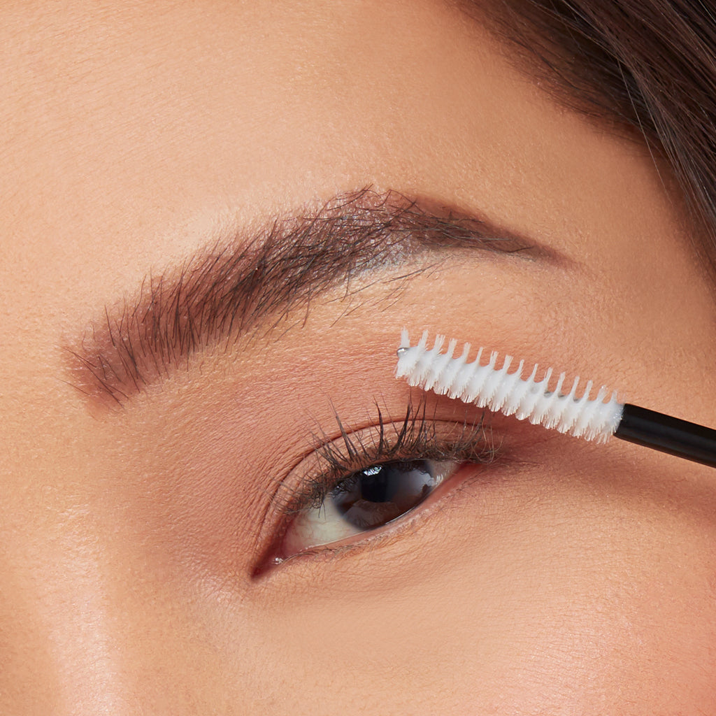 Woman applies GrandeREPAIR Leave-In Lash Conditioner for stronger and softer lashes